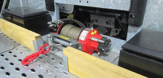 Protective wooden bastaings in front of the storage bins