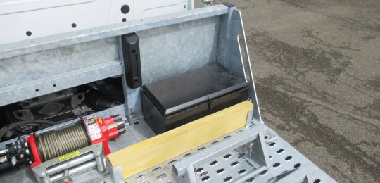 Protective wooden bastaings in front of the storage bins