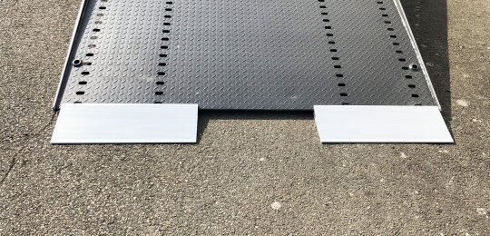 Two small aluminium ramps 700x250 mm with support on equipment for loading vehicles on the platform with trolleys