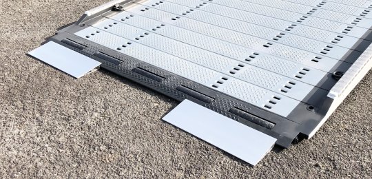 Two small aluminium ramps 700x250 mm with support on equipment for loading vehicles on the platform with trolleys