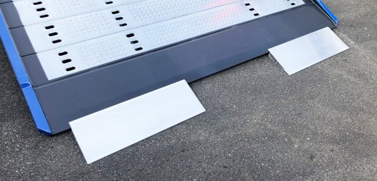 Two small aluminium ramps 700x250 mm with support on equipment for loading vehicles on the platform with trolleys