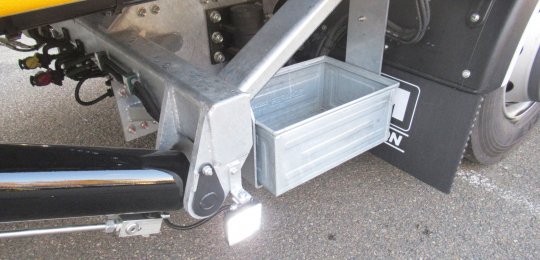 An open galvanized mesh tray for chains with support