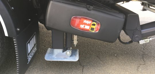 A 6 Kg fire extinguisher mounted in a secure locker