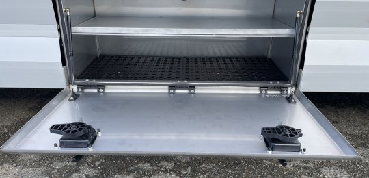 A horizontal shelf positioned in the middle of an 800mm stainless steel tool cabinet